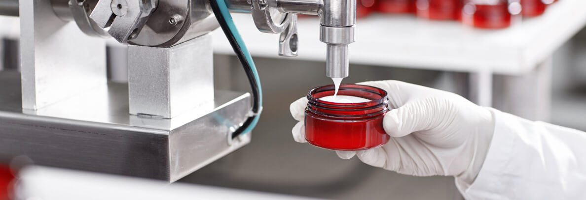 worker-filling-container-with-cream-cosmetic-factory 1 (1)