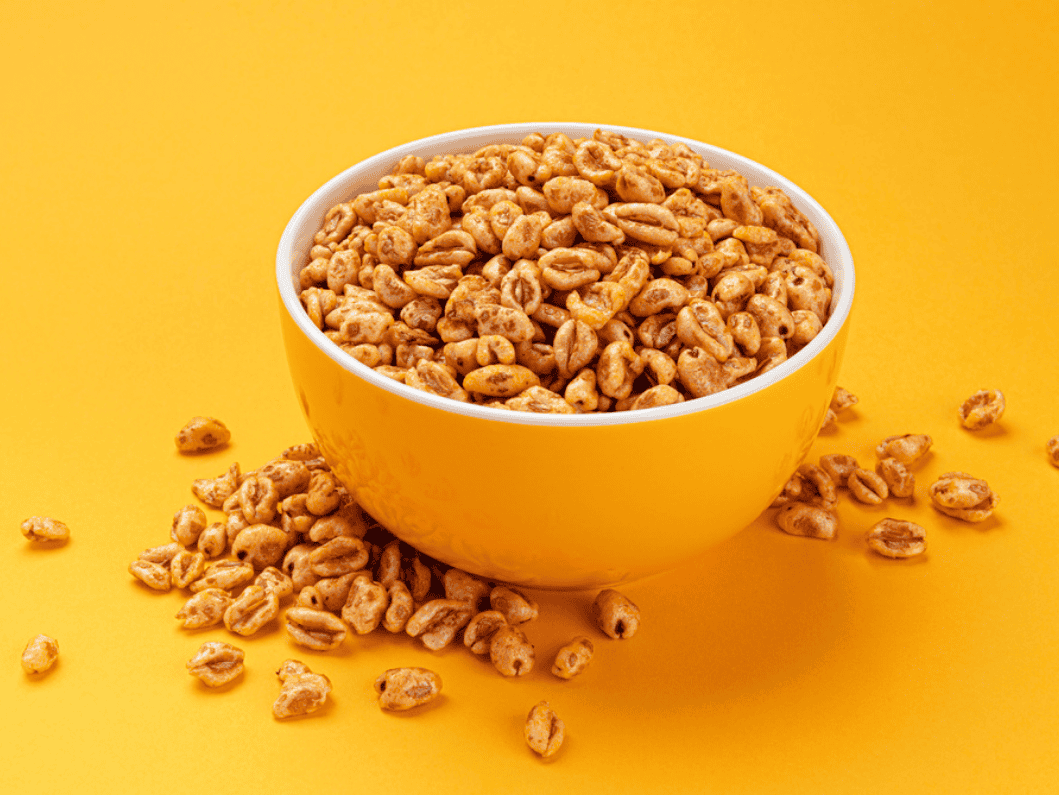Wheat puffs in yellow bowl