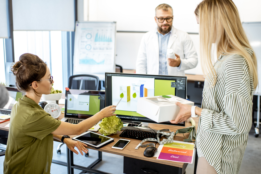 Group,Of,Diverse,People,Working,On,The,Packaging,Design,Of